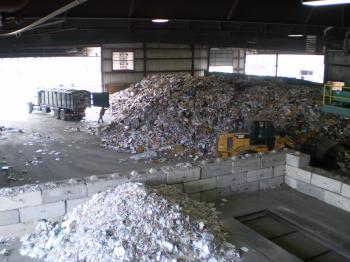 Piles of shredded recycling material in a plant